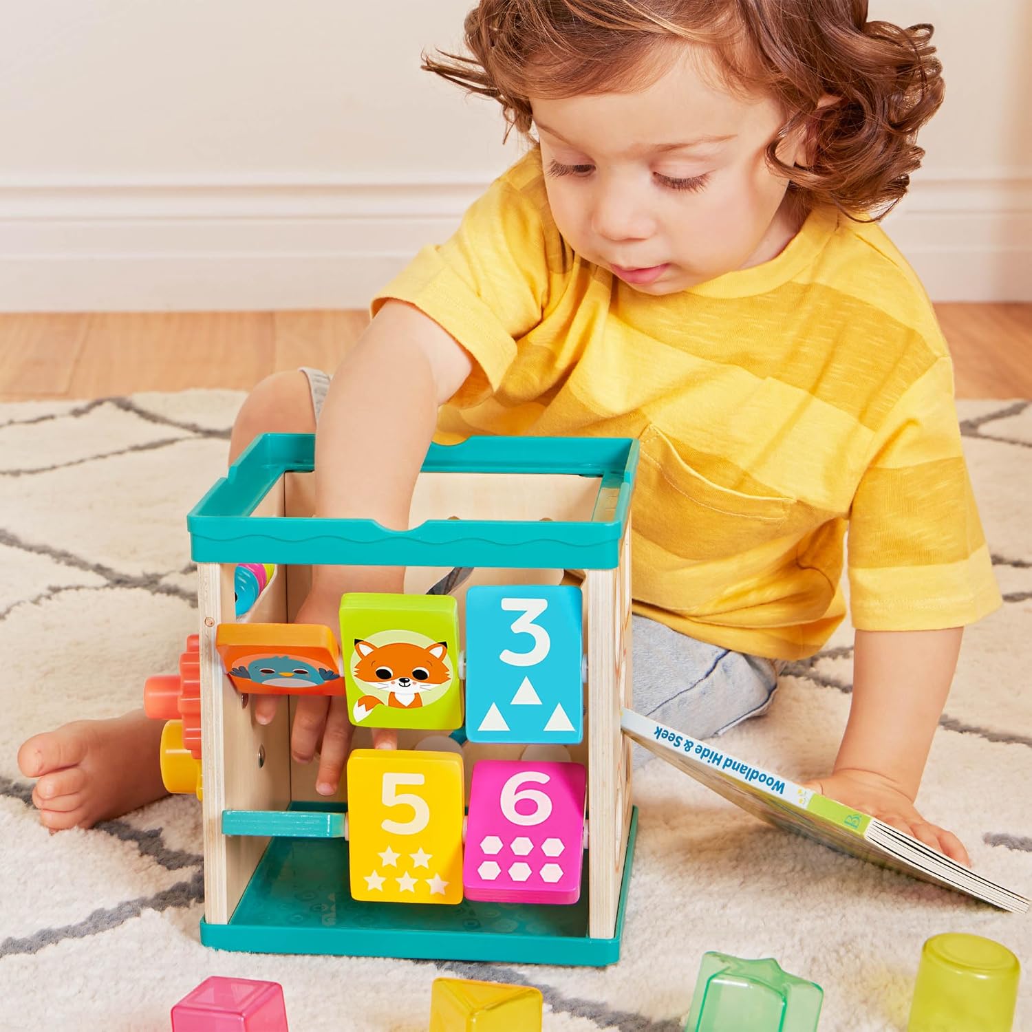 B. toys – Tabletop Activity Cube – Educational Storybook Included – Wooden Shape Sorter, Bead Maze, Animal Tiles – Top Flips for Compact Storage – 12+ Months – Lil' Learning Cube - Image 9